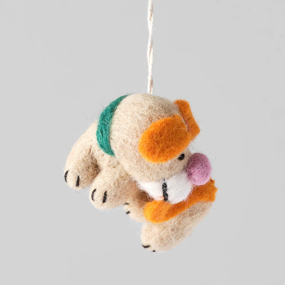 Adorno perro Bingo persiguiéndose la cola